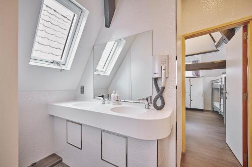 a bathroom with a sink and a mirror at The Classic by 2GO4 Grand Place in Brussels