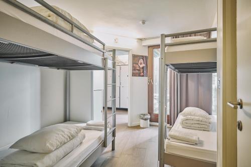 two bunk beds in a room with a hallway at The Classic by 2GO4 Grand Place in Brussels