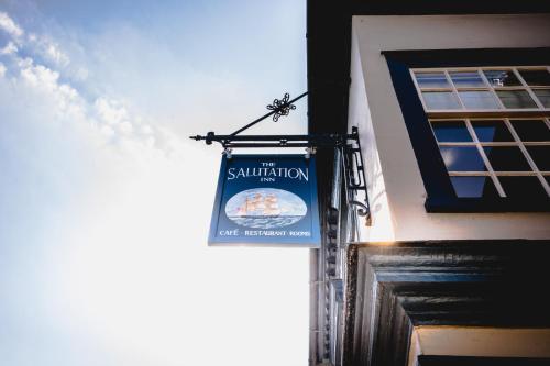 a sign for a restaurant on the side of a building at The Salutation Inn in Topsham