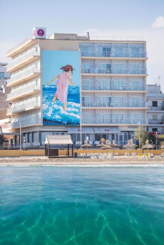 a large building with a picture of a girl on the beach at JS Ca'n Picafort in Can Picafort
