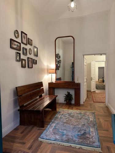 a living room with a bench and a mirror at Dar Sayang in Taif