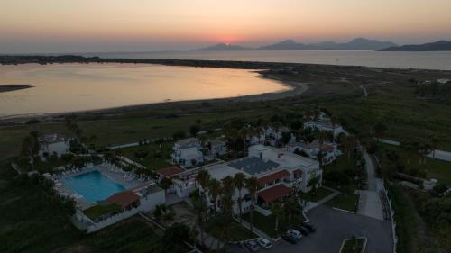 an aerial view of a house next to a body of water at Hotel Tigaki's Star in Tigaki