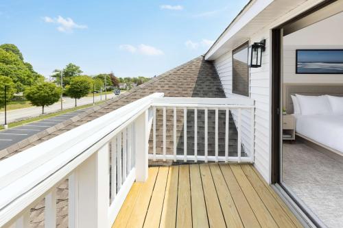 a balcony with a bedroom and a bed on it at The Pell, Part of JdV by Hyatt in Middletown