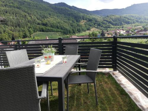 a table and chairs on a balcony with a view at Ferienhaus Johanna in Spitz