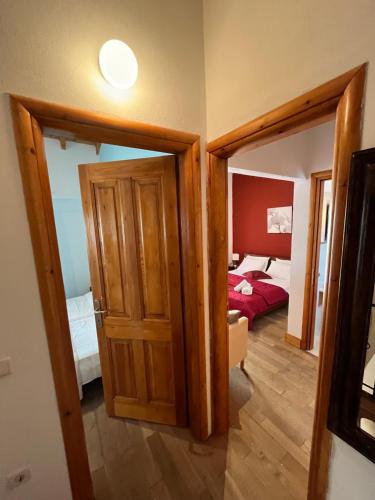 a room with a door leading to a bedroom at Vagelis house - Gardelades in Corfu Town