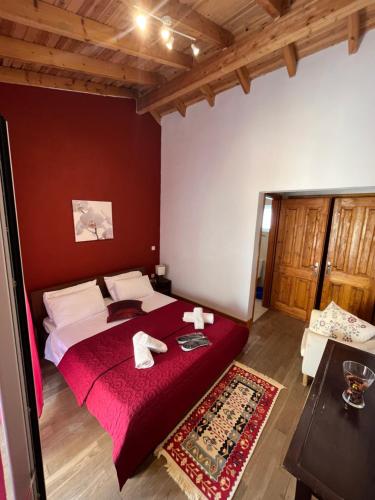 a bedroom with a bed with two towels on it at Vagelis house - Gardelades in Corfu Town