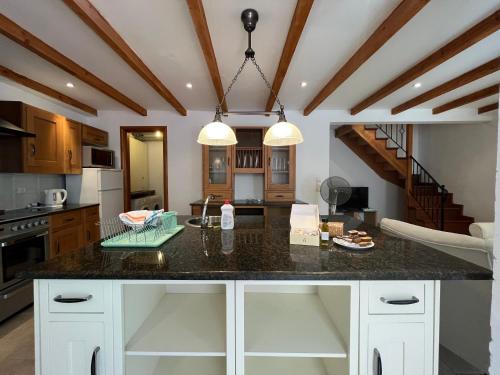 a kitchen with a large island in the middle at Vagelis house - Gardelades in Corfu Town