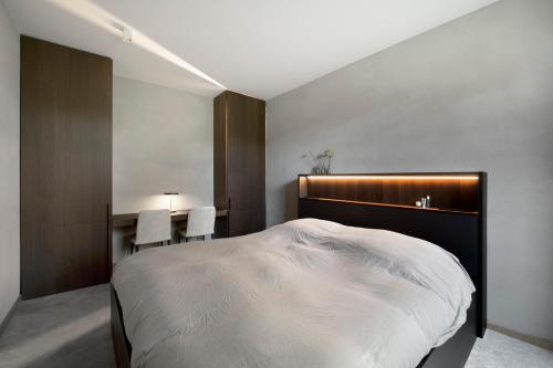 Ein Bett oder Betten in einem Zimmer der Unterkunft Nuit Blanche
