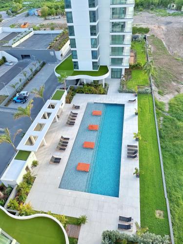 an aerial view of a building with a swimming pool at Mullet Bay Suites - Your Luxury Stay Awaits in Cupecoy