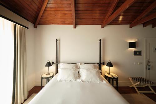 Ein Bett oder Betten in einem Zimmer der Unterkunft Octant Lousa