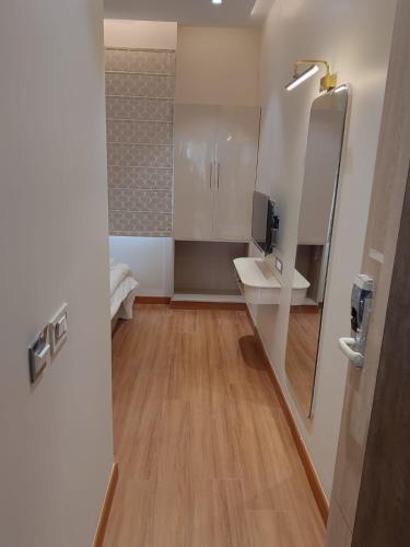 a bathroom with a sink and a mirror at Buddha Stays in Varanasi