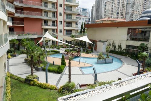 an aerial view of a courtyard in a building at 5 Star Hotel Concept Apartments with Spa and Sport Center in Esenyurt