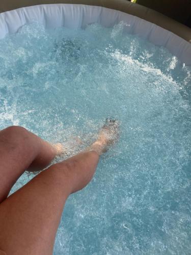 a persons index finger in a pool of water at Pod Świerkami in Zakrzówek