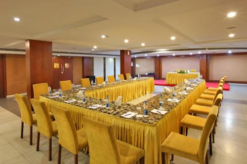 a large banquet hall with long tables and chairs at Cochin Palace in Cochin