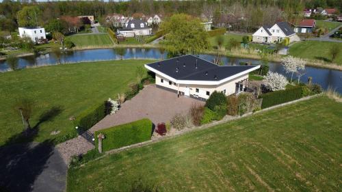 an aerial view of a house with a large yard at Villa Vera in Zeewolde