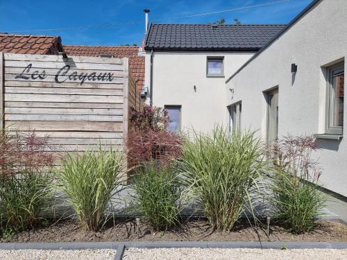 a house with a sign that reads no apartment at Les Cayaux in Brugelette