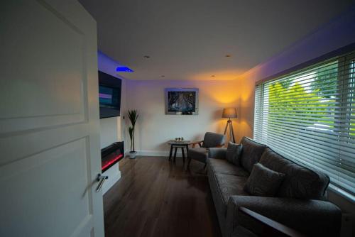 a living room with a couch and a table at Binevenagh View, Magilligan Holiday Let in Limavady