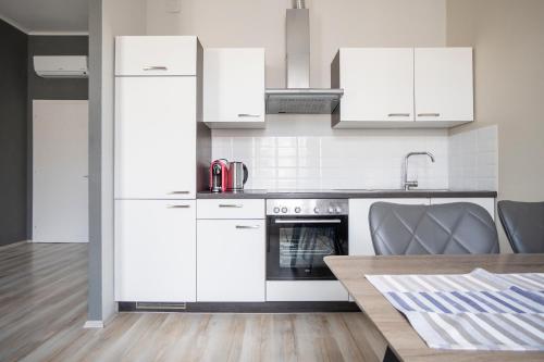 Η κουζίνα ή μικρή κουζίνα στο Brand new charming appartmet near augarten & city