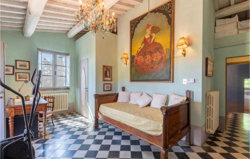 チッタ・デッラ・ピエーヴェにあるPoggiolo Dei Servitiのチェックフロアのベッドルーム1室(ベッド1台付)