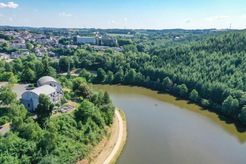 an aerial view of a river and a town at Hotel Bô Rivage in Neufchâteau