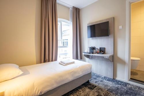 Кровать или кровати в номере Fletcher Hotel Landgoed Huis te Eerbeek