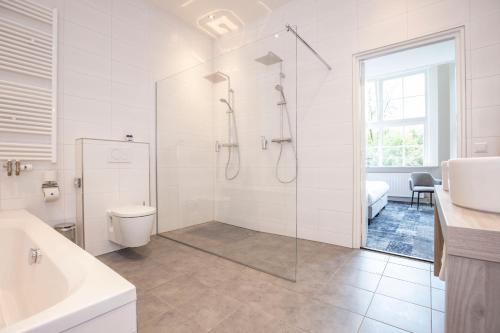 Ванная комната в Fletcher Hotel Landgoed Huis te Eerbeek