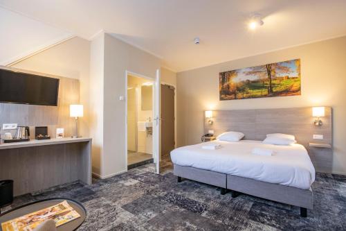 Кровать или кровати в номере Fletcher Hotel Landgoed Huis te Eerbeek