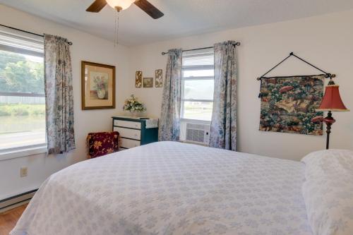 a bedroom with a bed and a window at Cozy North Tazewell Home Rental on Clinch River! in Tazewell