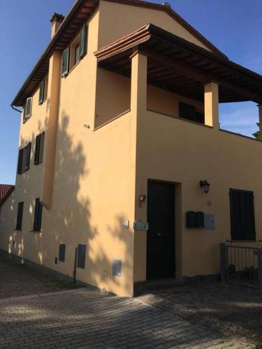 a building with a door on the side of it at Il mondo magico - Immerso nella natura - in Fauglia