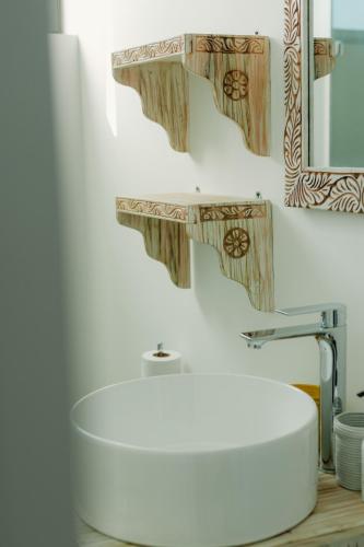 a bathroom with a white sink and a mirror at Villa Citrus Zanzibar in Jambiani