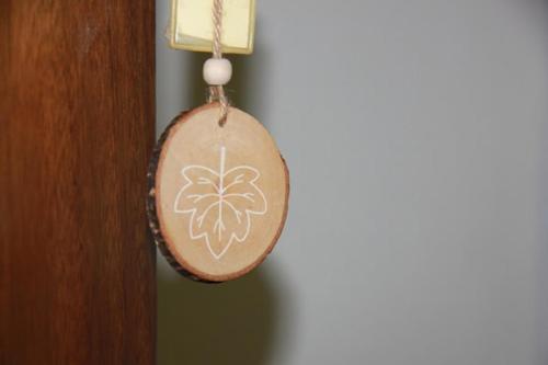 a christmas ornament is hanging on a wall at PLATANOFYLLA Studios & Apartments in Kala Nera
