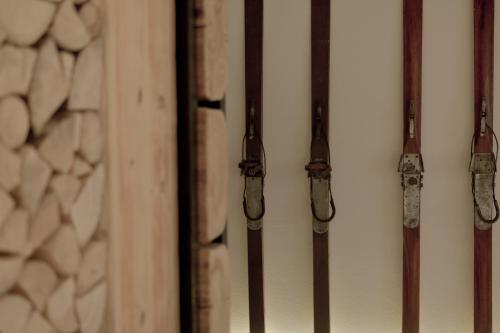 a bunch of wooden bars on a wall at Villa 11 Folk & Design in Zakopane
