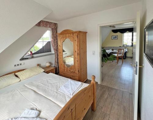 a bedroom with a bed and a large window at Villa Vivien Wohnung Bernstein in Göhren