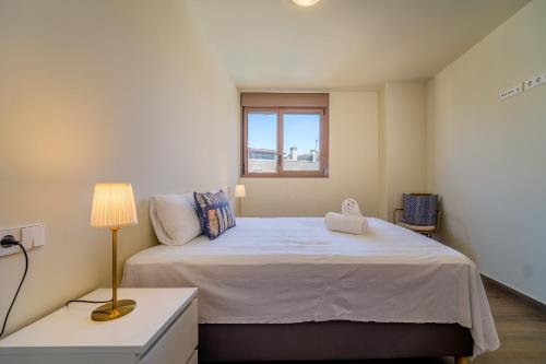 Кровать или кровати в номере Golden Star Apartment Javea Arenal by Rock Rentals