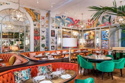 a restaurant with colorful walls and tables and chairs at Beautiful little Townhouse situated in Brighton's Regency Conservation Area in Brighton & Hove