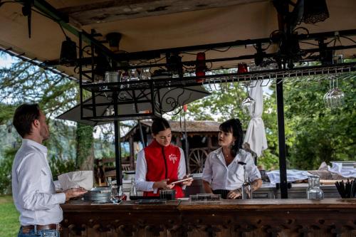 a man and a woman standing at a bar at Le Coucou Hotel Restaurant & Lounge-Bar in Montreux