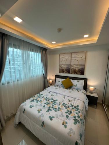 Postel nebo postele na pokoji v ubytování Arcadia Beach Con