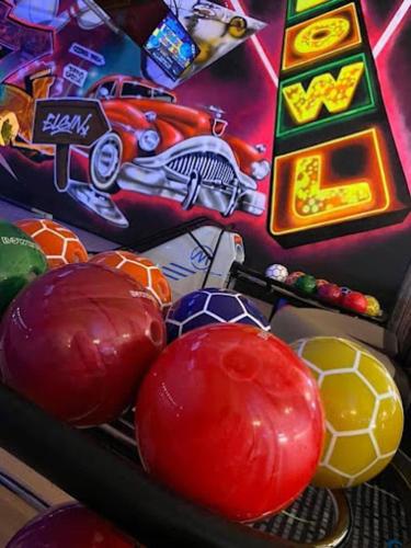 a close up of balls on a pinball machine at The Hudson @ Silversands in Lossiemouth