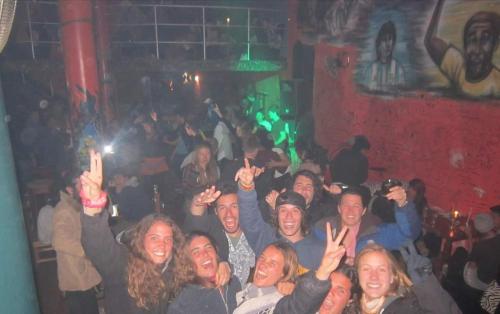 a group of people in a crowd in a bar at Wayky's Club and Hostal in Copacabana