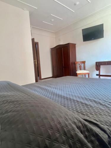 Ein Bett oder Betten in einem Zimmer der Unterkunft Lo Scrigno B&B