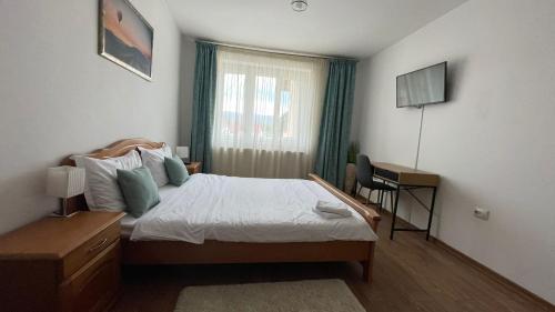 Ένα ή περισσότερα κρεβάτια σε δωμάτιο στο Apartament Panoramic Toplița