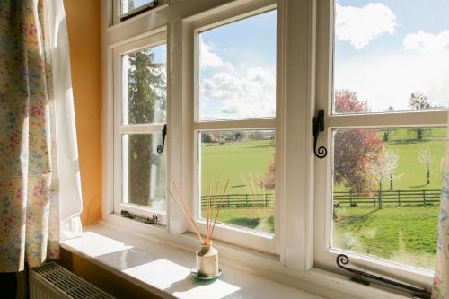 a window with a view of a green field at Huntlands Farm Bed & Breakfast in Bromyard
