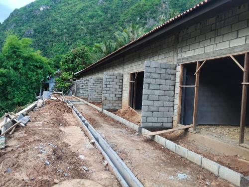 a house under construction with a building foundation at My Nongkhiaw in Nongkhiaw
