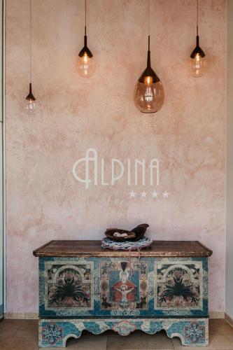 a table in front of a wall with lights at Alpina Wagrain in Wagrain