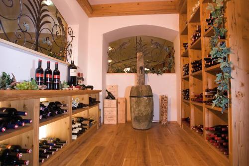 a wine cellar with a bottle of wine on the floor at Alpina Wagrain in Wagrain