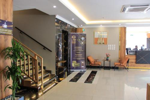 a lobby with a staircase in a building at شقق سوات للشقق المخدومة 4 in Al Khobar