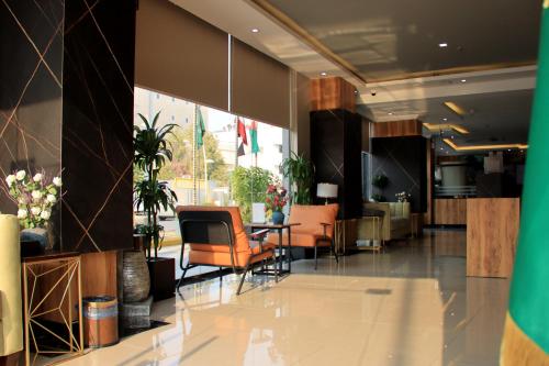 a lobby with chairs and a table in a building at شقق سوات للشقق المخدومة 4 in Al Khobar