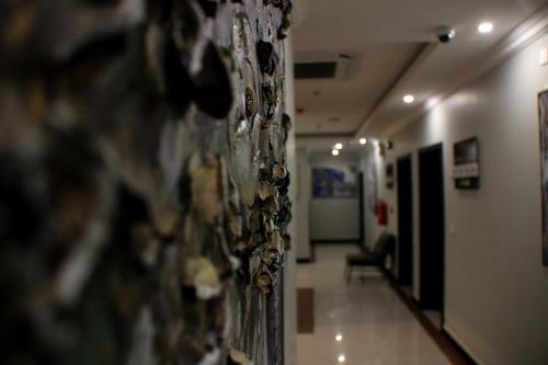 a hallway in a hospital with a wall at شقق سوات للشقق المخدومة 4 in Al Khobar