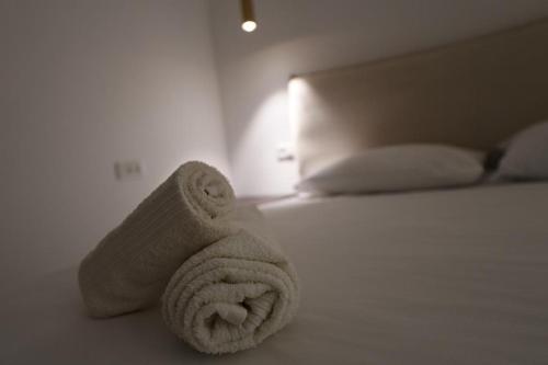 a towel on a bed in a room at Angel's place in Eilat