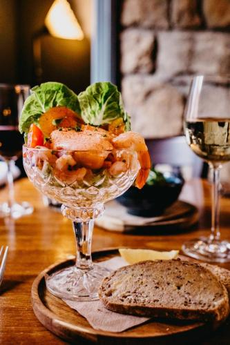 a glass bowl of shrimp and lettuce on a table at Coorie Inn Restaurant and Rooms in Crieff